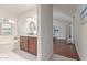 Bathroom showcasing a standalone tub, vanity, and a view into the bedroom at 15816 W Amelia Dr, Goodyear, AZ 85395