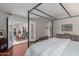 Bedroom featuring a four-poster bed and an open doorway to an adjoining room at 15816 W Amelia Dr, Goodyear, AZ 85395