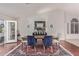 Charming dining room with wood table, plush chairs, and elegant rug for Gathering meals at 15816 W Amelia Dr, Goodyear, AZ 85395