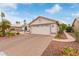 Charming single-story home with a two-car garage and desert landscaping at 15816 W Amelia Dr, Goodyear, AZ 85395