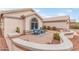 Charming patio with two blue Adirondack chairs and mature desert landscaping at 15816 W Amelia Dr, Goodyear, AZ 85395