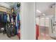 Garage access from closet provides storage and entry to a tidy space with bike and tool storage at 15816 W Amelia Dr, Goodyear, AZ 85395