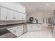 Bright kitchen with white cabinets, stainless appliances, and granite countertops at 15816 W Amelia Dr, Goodyear, AZ 85395