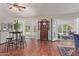 Bright living room featuring hardwood floors and large sliding doors to bring the outdoors in at 15816 W Amelia Dr, Goodyear, AZ 85395