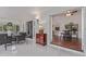 Inviting sunroom featuring wicker furniture and a decorative console table at 15816 W Amelia Dr, Goodyear, AZ 85395