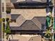 This aerial view shows the home's tile roof and the pool in the backyard at 16026 W Cortez St, Surprise, AZ 85379