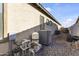 This is a view of the home's backyard utilities, like the HVAC system and a water heater at 16026 W Cortez St, Surprise, AZ 85379