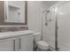 Bathroom with a white vanity, modern fixtures, and a glass-enclosed shower at 16026 W Cortez St, Surprise, AZ 85379