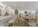 Bright, open kitchen and dining space features a large island with seating and farmhouse-style decor at 16026 W Cortez St, Surprise, AZ 85379