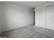 This bedroom features neutral walls, carpet and standard closet at 17307 W Via Dona Rd, Surprise, AZ 85387