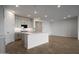 Modern kitchen showcasing an island with pendant lighting and an open layout with hardwood-style floors at 17307 W Via Dona Rd, Surprise, AZ 85387