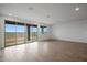 Large sliding glass doors flood the room with natural light and provide access to the backyard at 17307 W Via Dona Rd, Surprise, AZ 85387