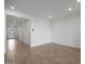 The living room features an open floor plan with tile flooring at 17307 W Via Dona Rd, Surprise, AZ 85387