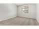 A simple bedroom with neutral carpet and a window at 17547 W Lupine Ave, Goodyear, AZ 85338