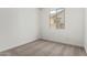 A bright bedroom with neutral carpet and bright white walls at 17547 W Lupine Ave, Goodyear, AZ 85338