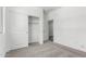 Neutral bedroom with closet and entry door at 17547 W Lupine Ave, Goodyear, AZ 85338