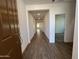 Inviting entryway with wood-look tile flooring leading into the home at 17547 W Lupine Ave, Goodyear, AZ 85338