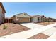 Charming single-story home featuring desert landscaping, a two-car garage, and a covered entryway at 17547 W Lupine Ave, Goodyear, AZ 85338