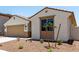 Charming single-story home featuring desert landscaping, a two-car garage, and a covered entryway at 17547 W Lupine Ave, Goodyear, AZ 85338
