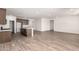 Open-concept kitchen and living room with tile floors and modern dark cabinetry at 17547 W Lupine Ave, Goodyear, AZ 85338