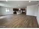 Open-concept living room with lots of natural light, tile floors, and kitchen view at 17547 W Lupine Ave, Goodyear, AZ 85338