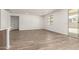 Bright living room featuring tile floors and sliding door to patio at 17547 W Lupine Ave, Goodyear, AZ 85338