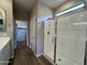 Bathroom showcasing glass enclosed shower and walk in closet at 17553 W Lupine Ave, Goodyear, AZ 85338