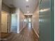 Inviting hallway with wood-look flooring and recessed lighting at 17553 W Lupine Ave, Goodyear, AZ 85338