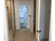 Contemporary bathroom offering a tile shower with glass door and a view into the walk-in closet and toilet room at 18035 W Vogel Ave, Goodyear, AZ 85338