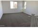 Large bedroom with neutral carpet and natural light at 18035 W Vogel Ave, Goodyear, AZ 85338