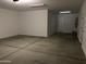 Spacious garage with concrete floors and ample lighting provides parking and storage at 18035 W Vogel Ave, Goodyear, AZ 85338