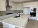 Bright kitchen with quartz countertops, subway tile backsplash and stainless steel appliances at 18035 W Vogel Ave, Goodyear, AZ 85338