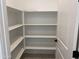 Walk-in pantry with abundant shelving at 18035 W Vogel Ave, Goodyear, AZ 85338