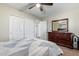 Neutral carpeted bedroom with a mirror, dresser, and closet at 21784 E Puesta Del Sol --, Queen Creek, AZ 85142