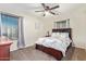 Carpeted bedroom featuring a wooden headboard and two windows at 21784 E Puesta Del Sol --, Queen Creek, AZ 85142