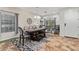 Elegant dining room featuring a large wooden table, stylish seating, and a decorative accent wall at 21784 E Puesta Del Sol --, Queen Creek, AZ 85142