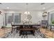 Elegant dining room featuring a large wooden table, stylish seating, and a decorative accent wall at 21784 E Puesta Del Sol --, Queen Creek, AZ 85142