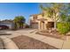 Inviting two-story home with a well-manicured front yard and charming stone accents on the facade at 21784 E Puesta Del Sol --, Queen Creek, AZ 85142