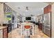 Open-concept living room features a connected kitchen and dining area with ample natural light at 21784 E Puesta Del Sol --, Queen Creek, AZ 85142