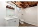 Renovated bathroom features white subway tile shower, new vanity, and wood-look floors in the basement at 2256 W Ella St, Mesa, AZ 85201