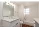 Bathroom featuring a tub, window and vanity with ample counter space at 2256 W Ella St, Mesa, AZ 85201