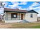 Inviting exterior view featuring front porch with brick steps and green trim at 2256 W Ella St, Mesa, AZ 85201