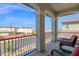 Balcony with wrought iron railing overlooking a street with homes at 2601 S Entwistle St, Gilbert, AZ 85295