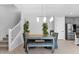 Inviting dining room featuring a modern table, stylish seating, and a contemporary light fixture at 2601 S Entwistle St, Gilbert, AZ 85295