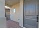 Covered front porch featuring beautiful brick flooring, neutral paint, and a sturdy, secure front door at 2601 S Entwistle St, Gilbert, AZ 85295