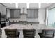 Sleek kitchen featuring gray cabinets, granite countertops, stainless steel appliances, and a stylish backsplash at 2601 S Entwistle St, Gilbert, AZ 85295