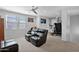 Bright living room with a ceiling fan and comfortable seating, ideal for relaxing at 2601 S Entwistle St, Gilbert, AZ 85295