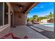 Inviting back patio with a ceiling fan, comfortable seating, and a view of the pool and fire pit at 3044 E Trigger Way, Gilbert, AZ 85297