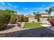 Expansive backyard showcasing the lawn, mature trees, landscaping and outdoor entertaining areas at 3044 E Trigger Way, Gilbert, AZ 85297