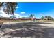 Outdoor basketball court surrounded by lush landscaping and well-maintained neighborhood at 3044 E Trigger Way, Gilbert, AZ 85297